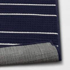 7'x10' Thin Stripe Rectangular Woven Outdoor Area Rug Navy/Ivory - Threshold™ -Threshold Outdoor Deals Store GUEST d8dd5e92 4349 401f 907f d39c6645ef8e